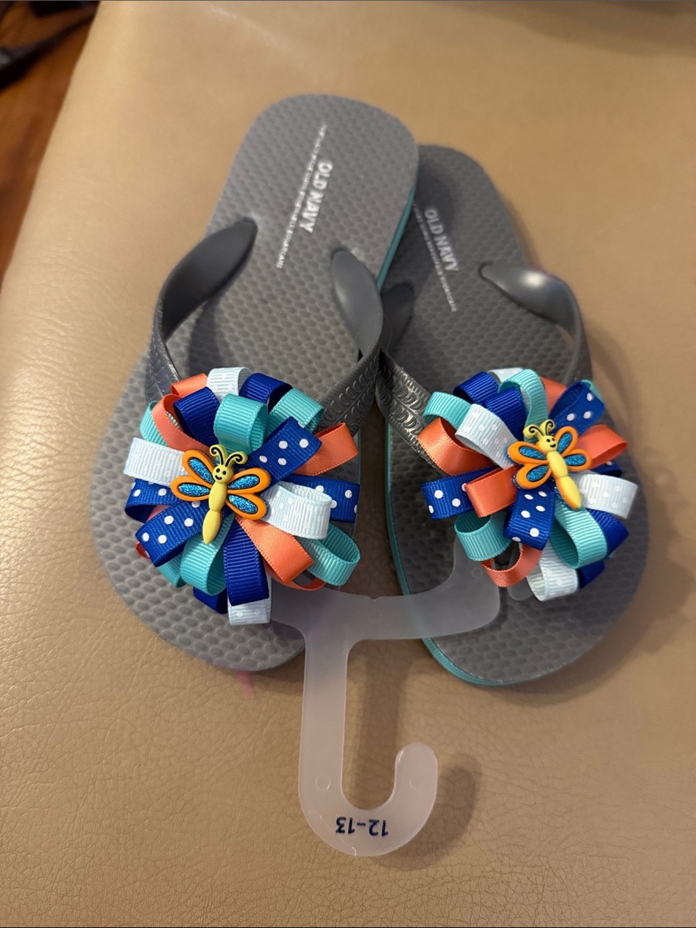 Old Navy Gray Flip Flops with Blue, Teal & Orange Bow Accents